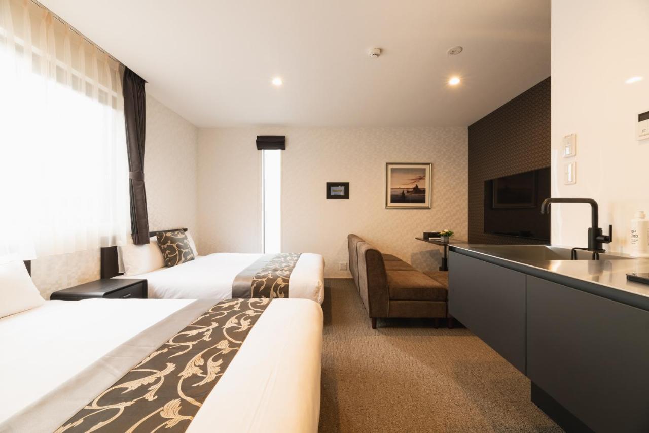Grand Base Nagasaki Ekimae Aparthotel Buitenkant foto